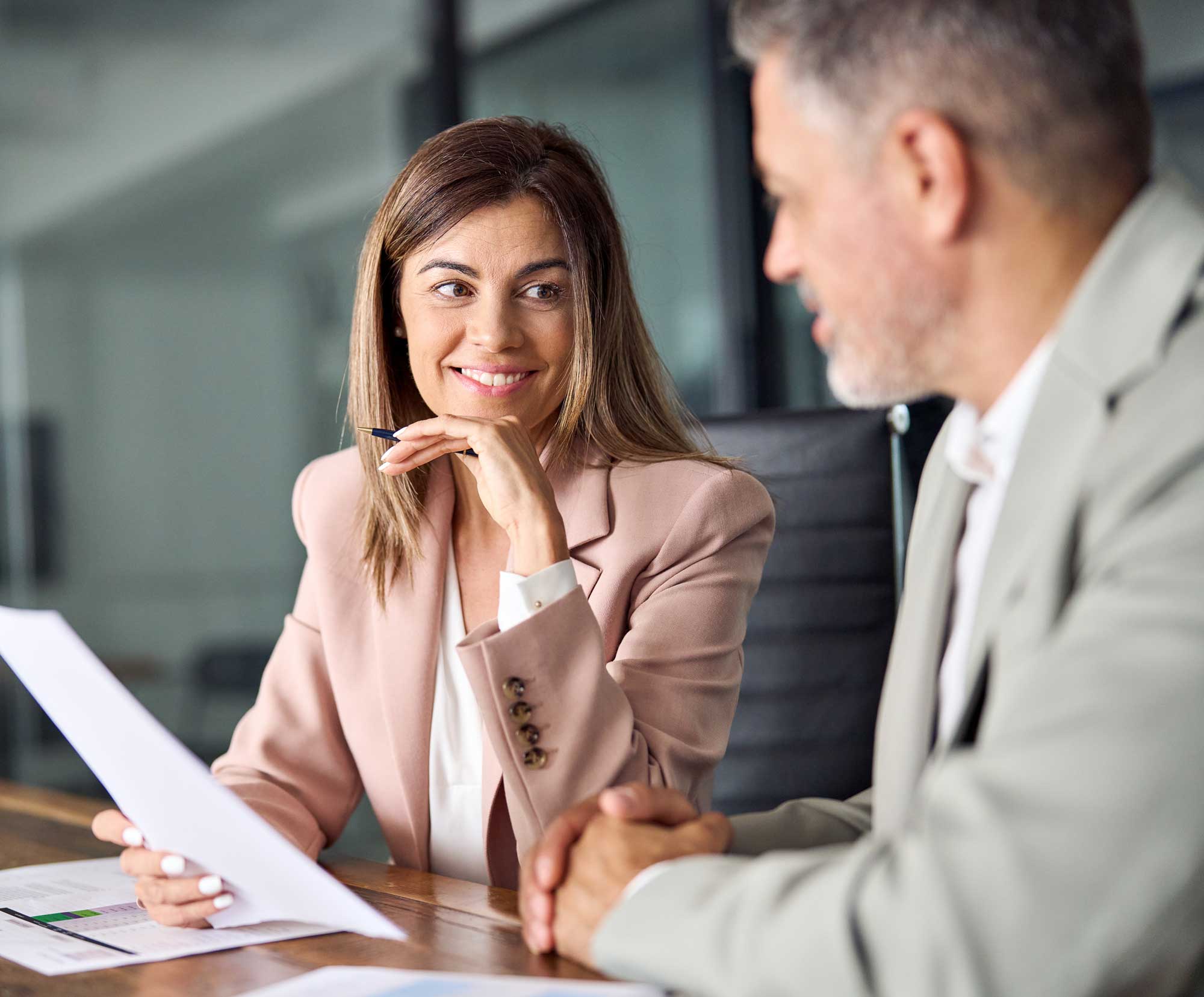 CFO reviewing financial documents in a meeting