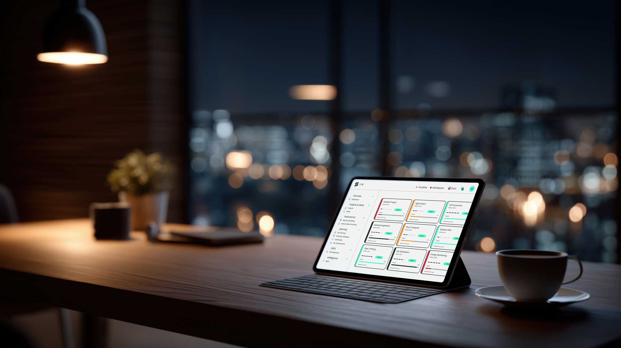 OpX dashboard on a tablet at a desk with a city skyline at night